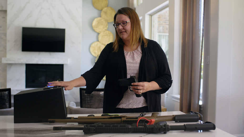 Dr. Sandra McKay demonstrates storage of hand gun in an automated lock box.